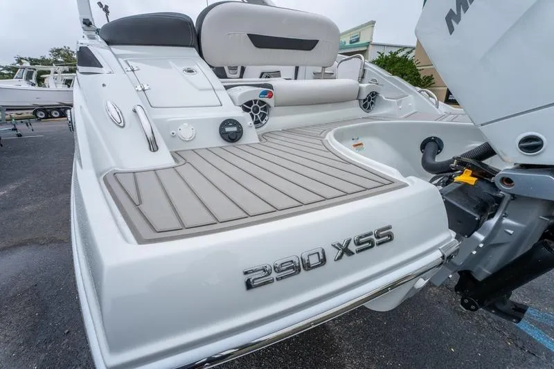 Slide: The Image of 2026 Crowline 290 XSS boat with sleek design and modern features, docked outdoors. - 22