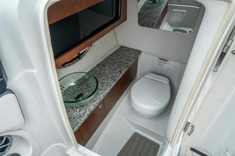 Slide: The Image of Luxurious bathroom in 2026 Crowline 290 XSS boat with granite countertop and modern fixtures. - 24
