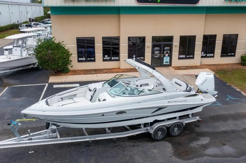 Slide: The Image of 2026 Crowline 290 XSS boat on trailer outside dealership. - 30