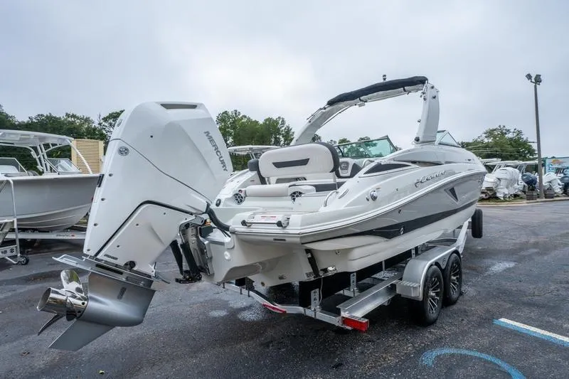 Slide: The Image of 2026 Crowline 290 XSS boat on trailer, featuring a powerful Mercury outboard engine. - 6