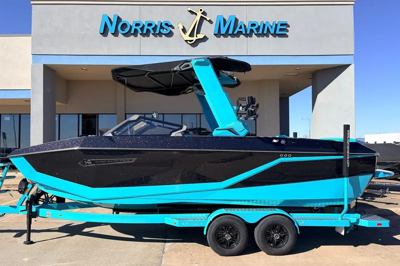 The Image of 2026 Nautique Super Air Nautique G23 boat in vibrant blue at Norris Marine dealership. - 1