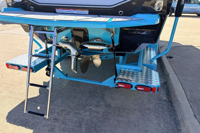 Slide: The Image of 2026 Nautique Super Air Nautique G23 boat rear view with ladder and platform. - 10