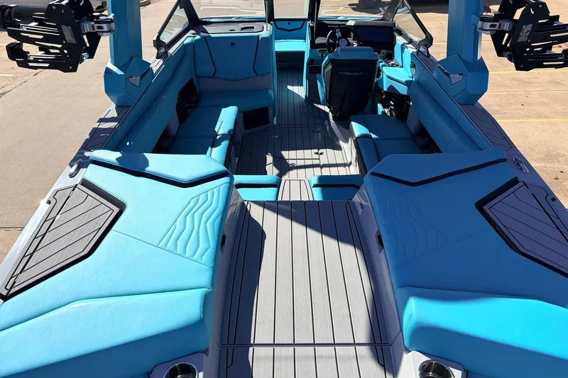 Slide: The Image of 2026 Nautique Super Air Nautique G23 boat interior with blue seating and modern design. - 11