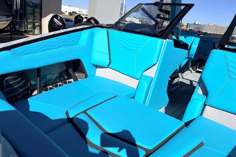 Slide: The Image of 2026 Nautique Super Air Nautique G23 interior with vibrant blue seating and modern design. - 17