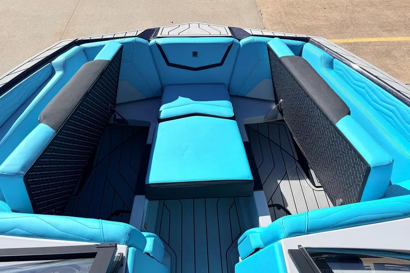 Slide: The Image of Interior view of 2026 Nautique Super Air Nautique G23 boat with blue seating. - 18