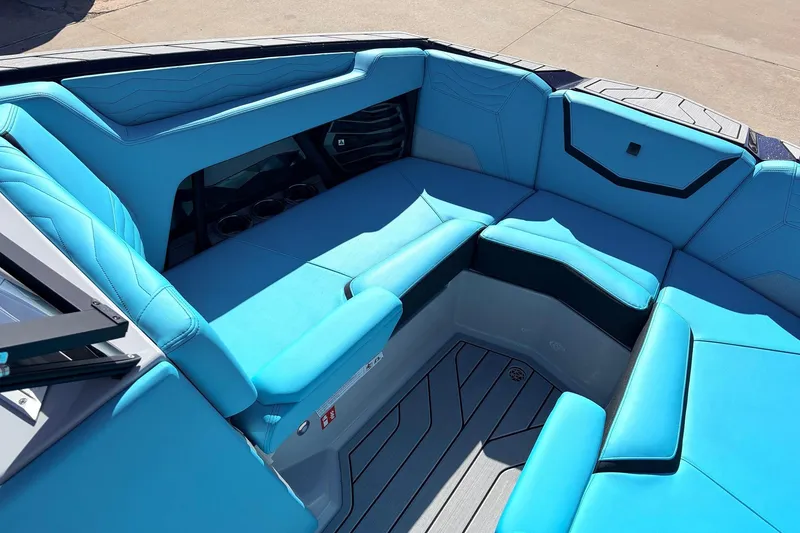 Slide: The Image of 2026 Nautique Super Air Nautique G23 boat interior with blue seating and modern design. - 20