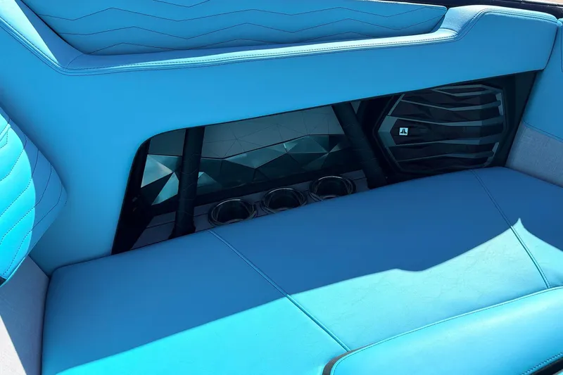 Slide: The Image of 2026 Nautique Super Air Nautique G23 interior with blue seating and speaker system. - 22