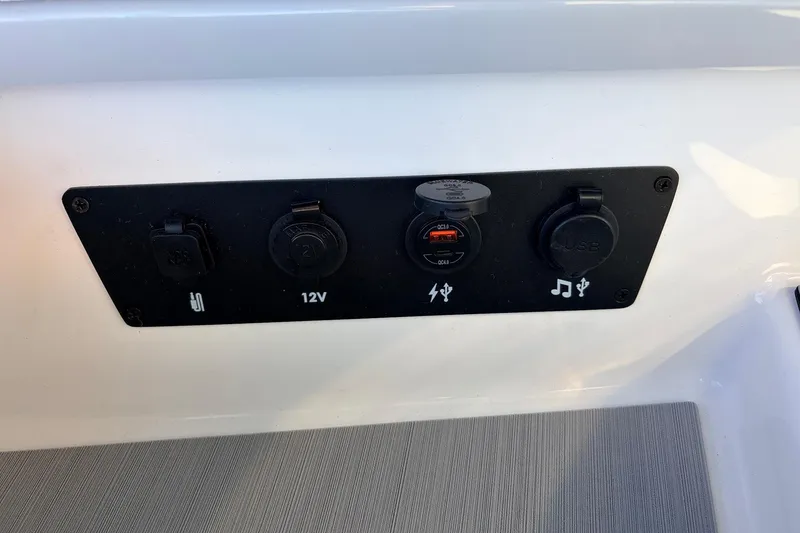 Slide: The Image of Control panel with USB and 12V ports on 2026 Nautique Super Air Nautique G23. - 27