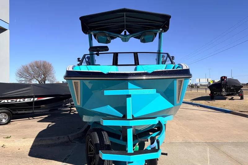 Slide: The Image of 2026 Nautique Super Air Nautique G23 boat in vibrant blue on a trailer. - 3