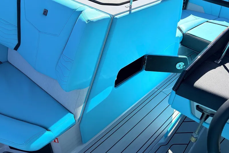 Slide: The Image of 2026 Nautique Super Air Nautique G23 interior with blue seating and sleek design. - 30