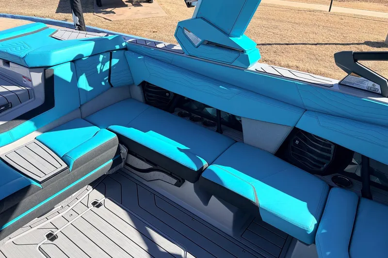 Slide: The Image of Interior of 2026 Nautique Super Air Nautique G23 with blue seating and modern design. - 31