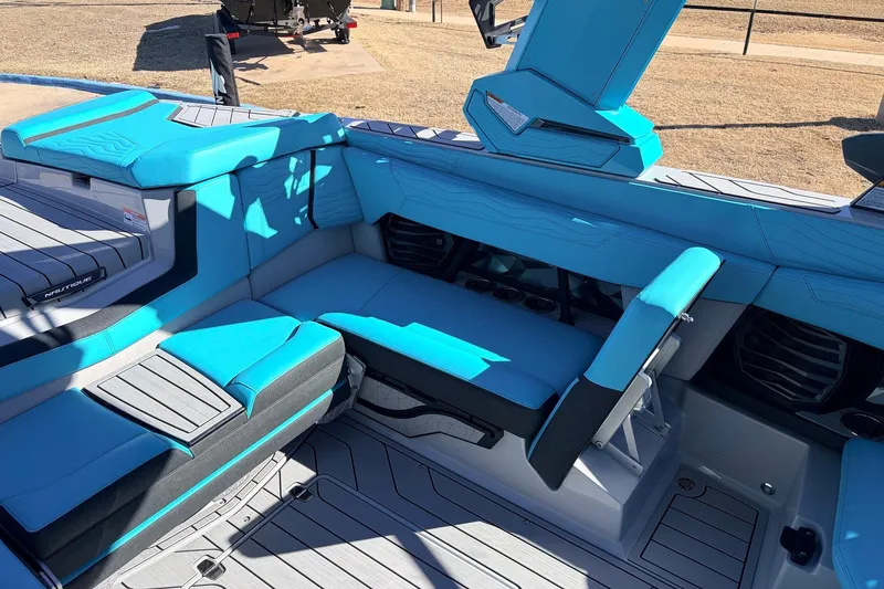 Slide: The Image of Interior of 2026 Nautique Super Air Nautique G23 with blue seating and modern design. - 32