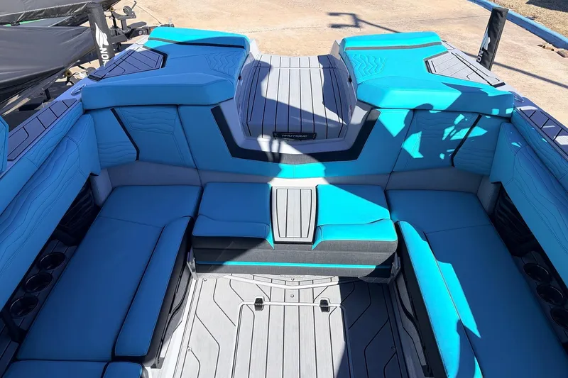 Slide: The Image of Interior of 2026 Nautique Super Air Nautique G23 with blue seating and sleek design. - 35