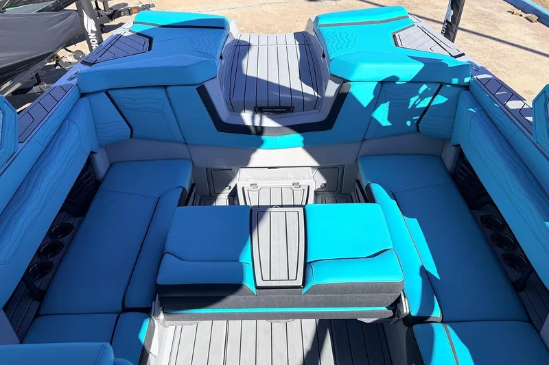 Slide: The Image of Interior of 2026 Nautique Super Air Nautique G23 with blue seating and modern design. - 36