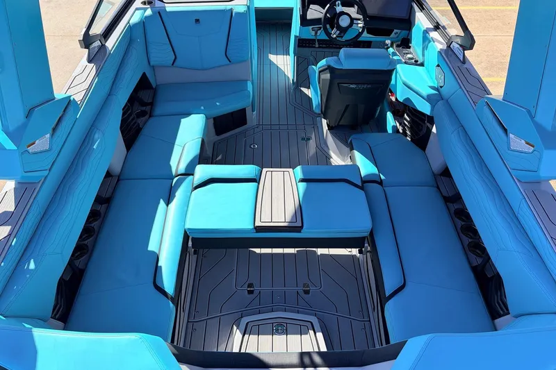 Slide: The Image of Interior of 2026 Nautique Super Air Nautique G23, featuring luxurious blue seating and modern design. - 37