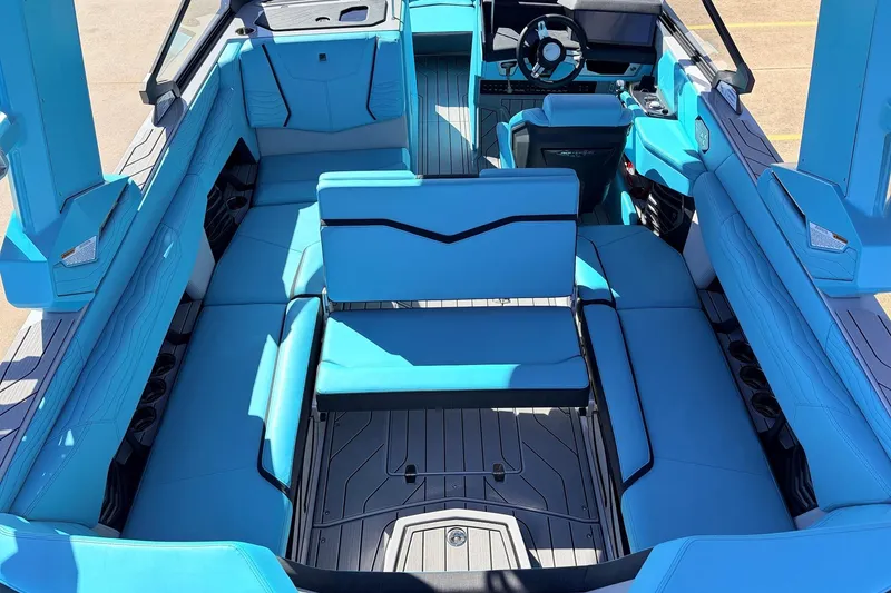 Slide: The Image of 2026 Nautique Super Air Nautique G23 interior with blue seating and modern design. - 38