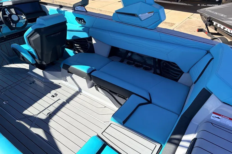 Slide: The Image of 2026 Nautique Super Air Nautique G23 interior with blue seating and modern design. - 41