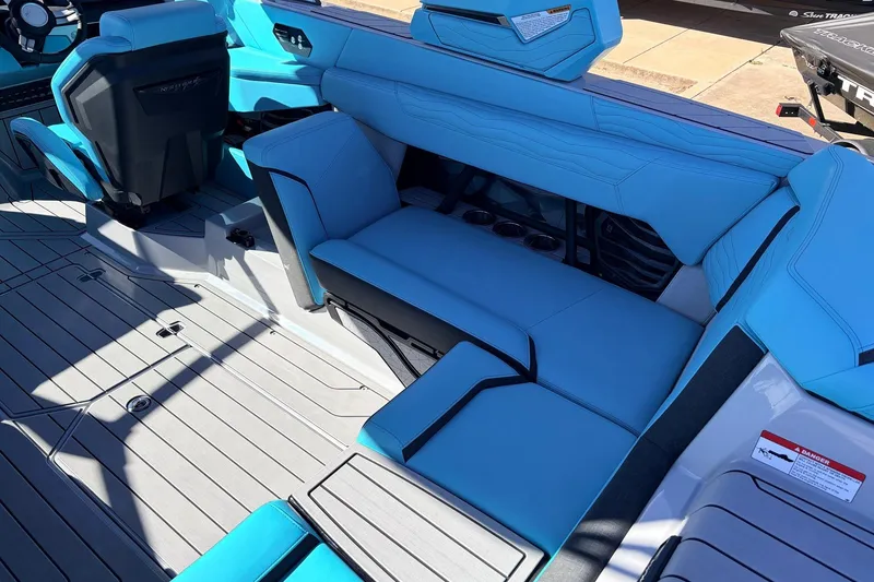 Slide: The Image of 2026 Nautique Super Air Nautique G23 interior with blue seating and modern design. - 43