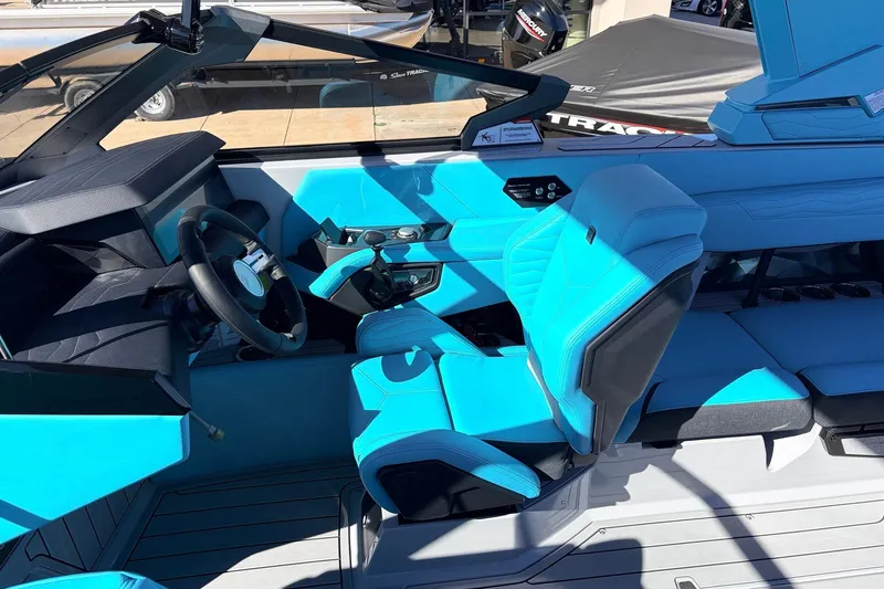 Slide: The Image of Interior of 2026 Nautique Super Air Nautique G23 with vibrant blue seating and modern controls. - 45