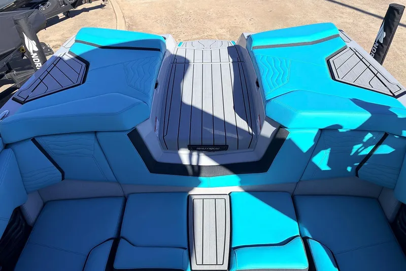 Slide: The Image of 2026 Nautique Super Air Nautique G23 boat interior with blue and gray seating. - 51