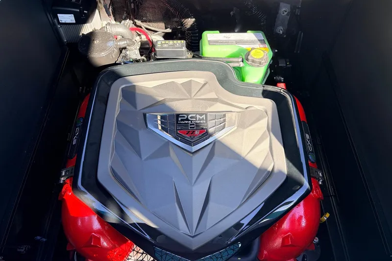 Slide: The Image of 2026 Nautique Super Air Nautique G23 engine compartment with PCM engine cover. - 55