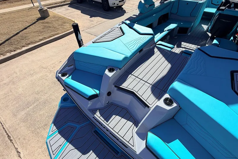 Slide: The Image of 2026 Nautique Super Air Nautique G23 boat interior with blue seating and sleek design. - 56