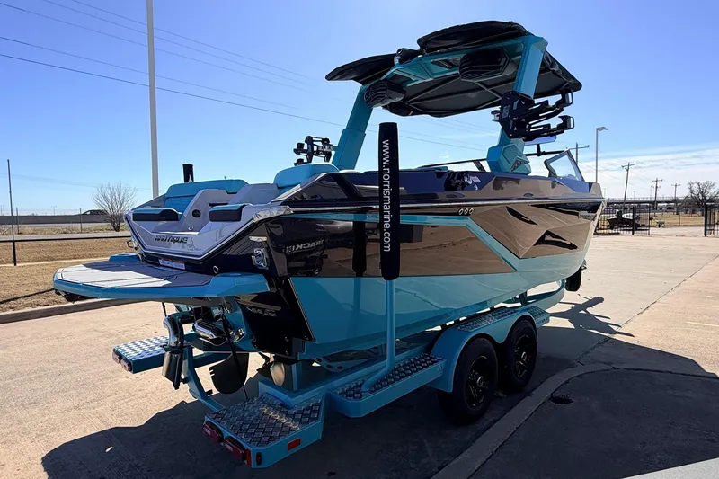 Slide: The Image of 2026 Nautique Super Air Nautique G23 boat on trailer, parked outdoors. - 6