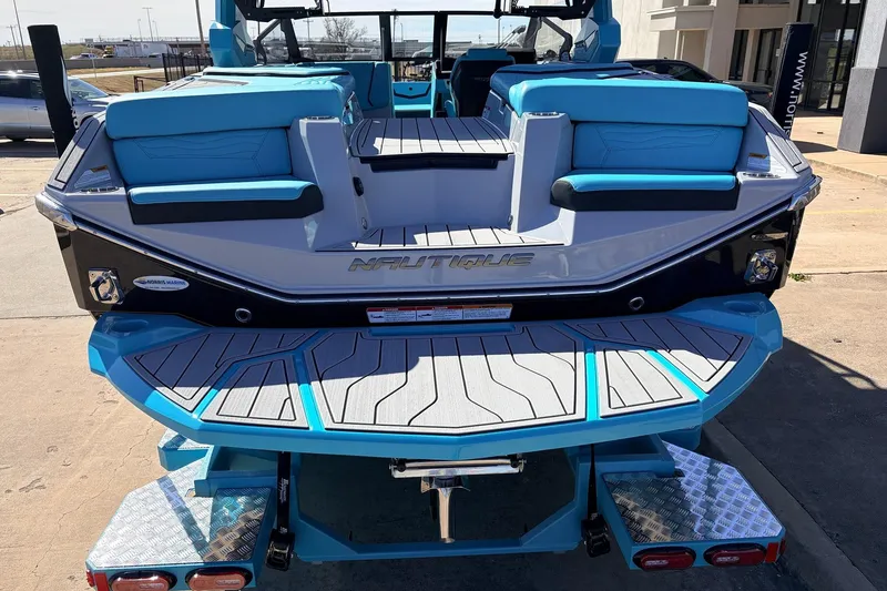 Slide: The Image of 2026 Nautique Super Air Nautique G23 boat with blue seating and sleek design. - 62