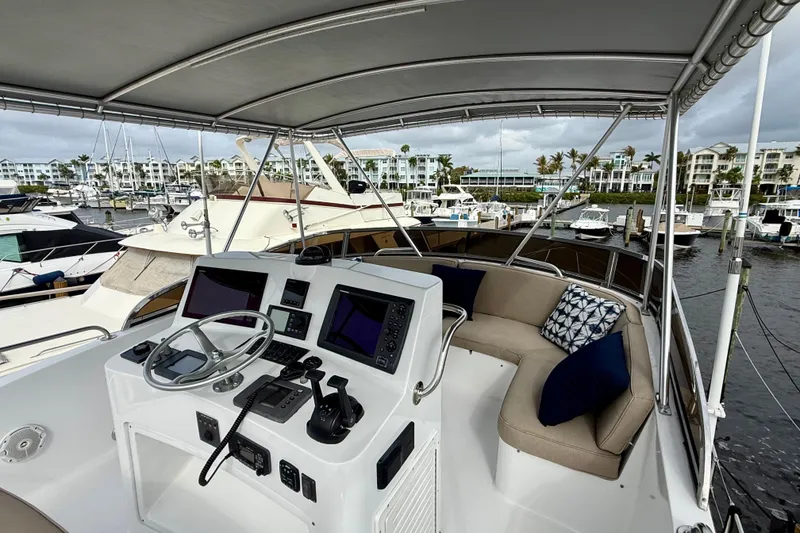 Slide: The Image of Cockpit view of 2002 Legacy 52 yacht with modern controls and seating at marina. - 20