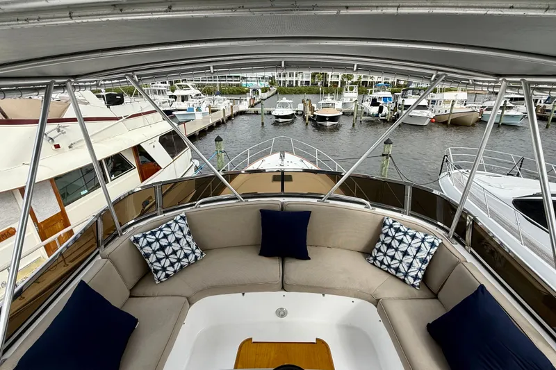 Slide: The Image of View from a 2002 Legacy 52 yacht's deck, overlooking a marina with multiple boats. - 23