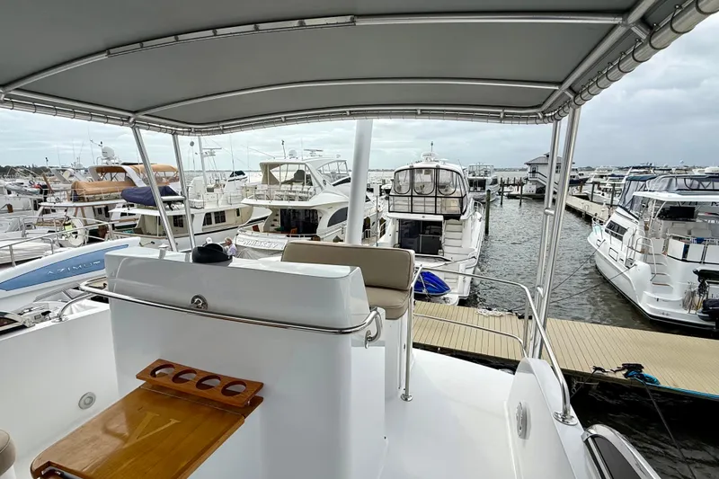 Slide: The Image of View from a 2002 Legacy 52 yacht overlooking a marina with multiple boats docked. - 25