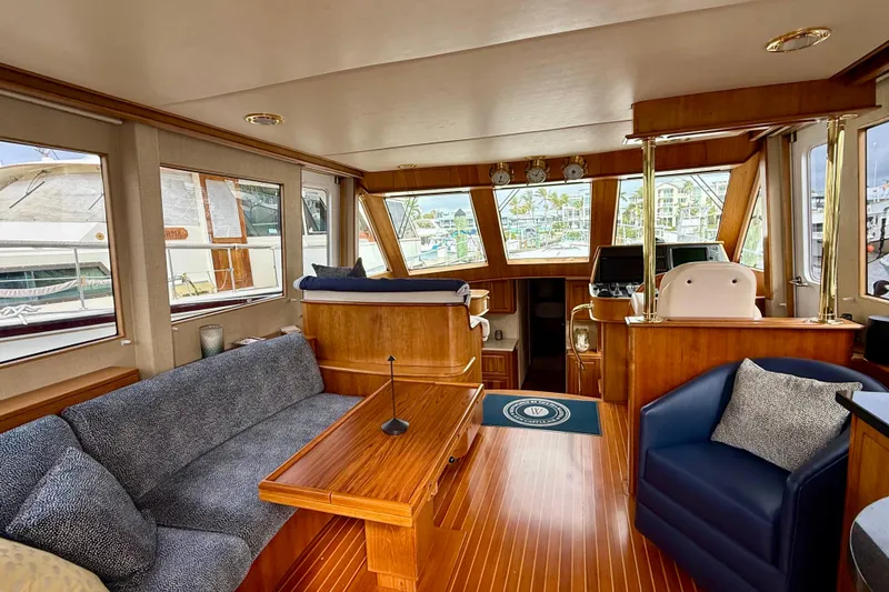 Slide: The Image of Luxurious interior of a 2002 Legacy 52 yacht with elegant wood finishes and comfortable seating. - 34