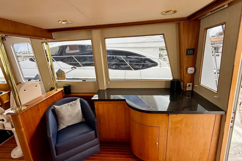 Slide: The Image of Luxurious interior of a 2002 Legacy 52 yacht with elegant wood and modern furnishings. - 36