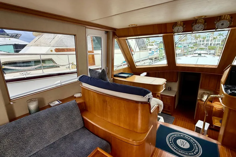 Slide: The Image of Interior of 2002 Legacy 52 yacht with wooden furnishings and large windows. - 38