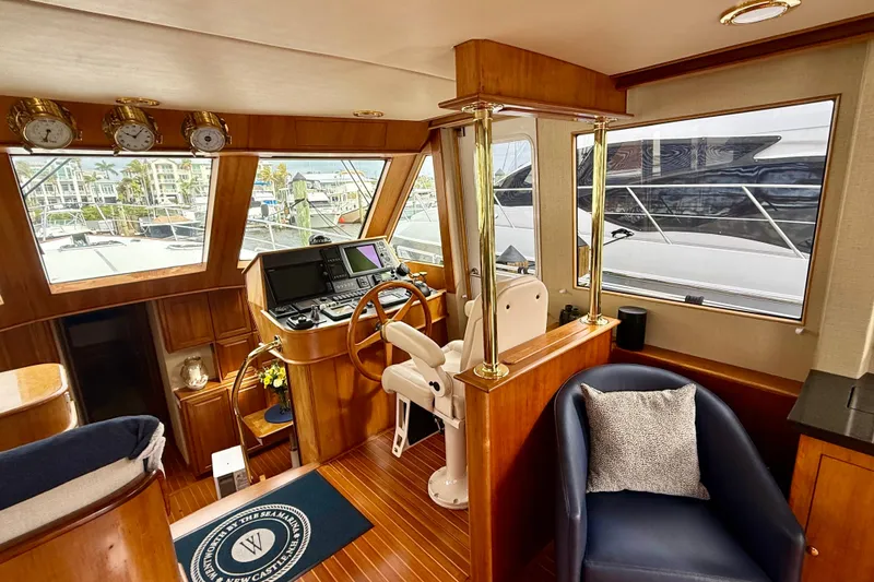 Slide: The Image of Luxurious interior of 2002 Legacy 52 yacht with wooden helm and plush seating. - 39