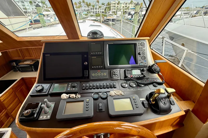 Slide: The Image of Cockpit of 2002 Legacy 52 yacht with navigation equipment and controls. - 42