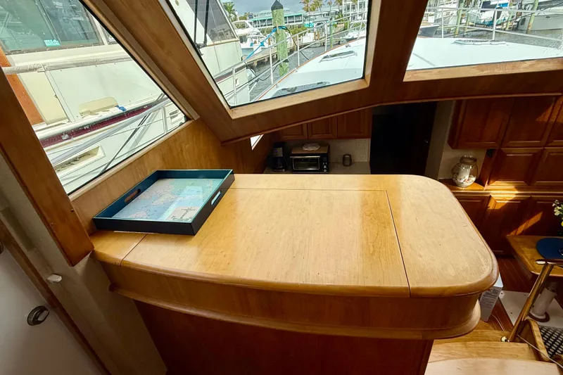 Slide: The Image of Interior of 2002 Legacy 52 yacht with wooden cabinetry and large windows. - 43
