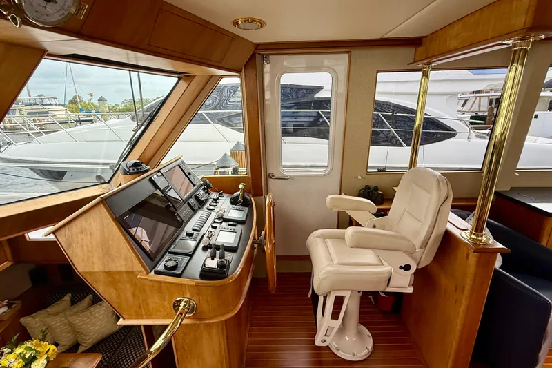 Slide: The Image of Luxurious 2002 Legacy 52 yacht helm with modern controls and comfortable captain's chair. - 45