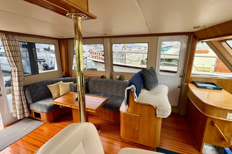 Slide: The Image of Luxurious 2002 Legacy 52 yacht interior with cozy seating and elegant wood finishes. - 47