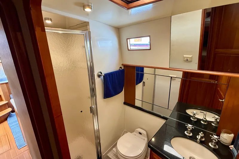 Slide: The Image of Luxurious bathroom in 2002 Legacy 52 yacht with shower, sink, and toilet. - 61