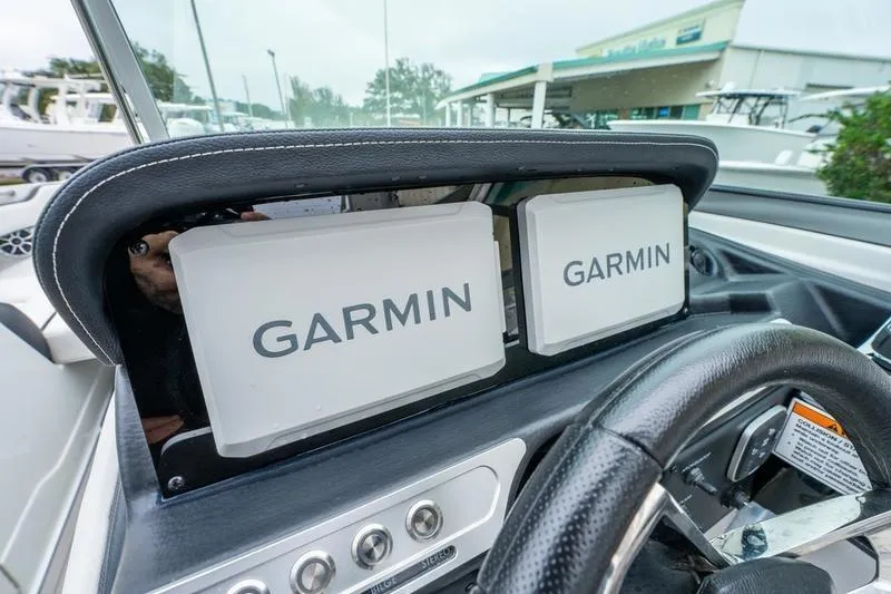 Slide: The Image of Dashboard of 2026 Crownline 318 XSS boat with dual Garmin displays. - 14