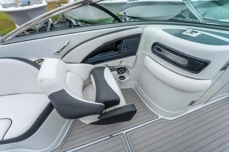 Slide: The Image of Interior of 2026 Crownline 318 XSS boat with modern seating and sleek design. - 20