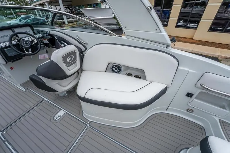 Slide: The Image of Interior of 2026 Crownline 318 XSS boat with sleek seating and modern dashboard. - 23