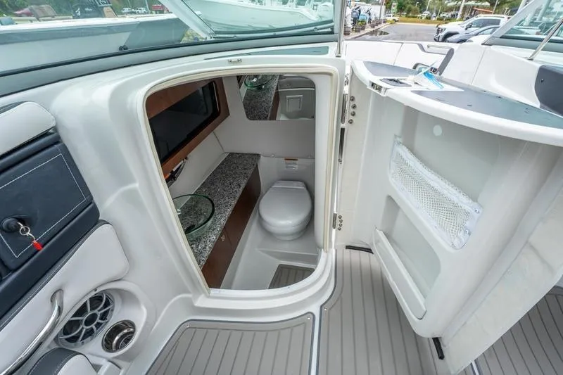Slide: The Image of Interior view of 2026 Crownline 318 XSS boat bathroom with modern amenities. - 28