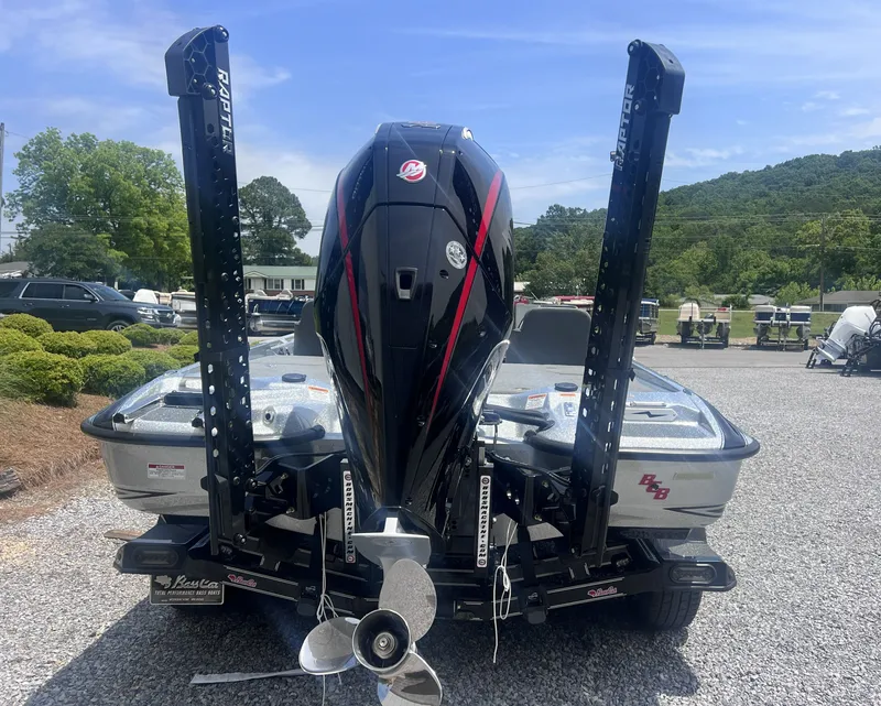 Slide: The Image of Rear view of a 2026 Bass Cat Lynx STS boat with outboard motor. - 14