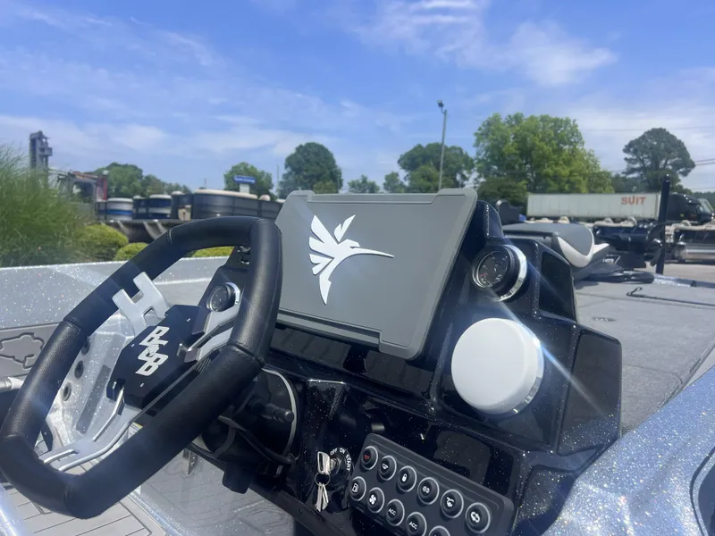 Slide: The Image of Dashboard of 2026 Bass Cat Lynx STS with steering wheel and controls. - 3