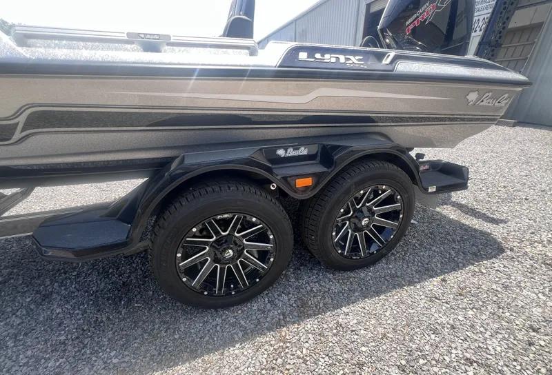 Slide: The Image of 2026 Bass Cat Lynx STS boat trailer with stylish wheels. - 8