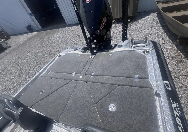 Slide: The Image of 2026 Bass Cat Lynx STS with gray deck and motor. - 9