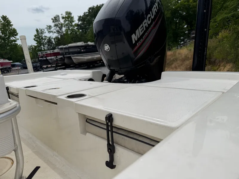 Slide: The Image of 2017 Mako Skiff 19 CPX with Mercury engine, side view. - 19