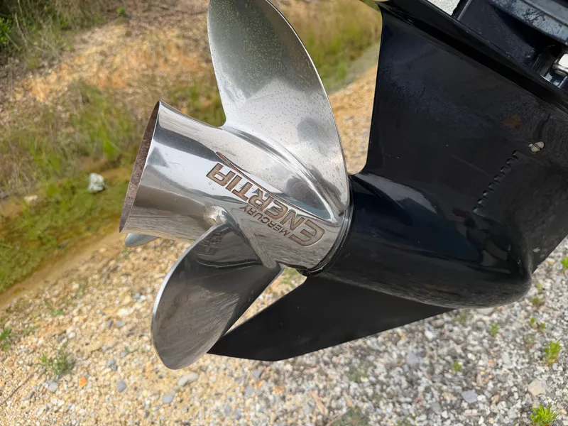 Slide: The Image of Close-up of a Mercury Enertia propeller on a 2017 Mako Skiff 19 CPX. - 21